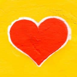 A picture of a heart shape on a yellow background.