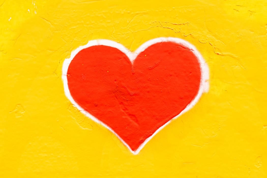 A picture of a heart shape on a yellow background.