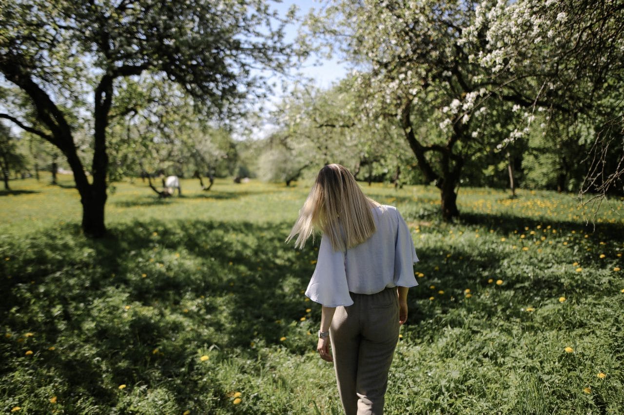 A woman walking in nature in spring.