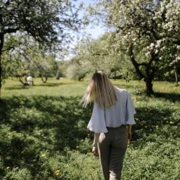 A woman walking in nature in spring.