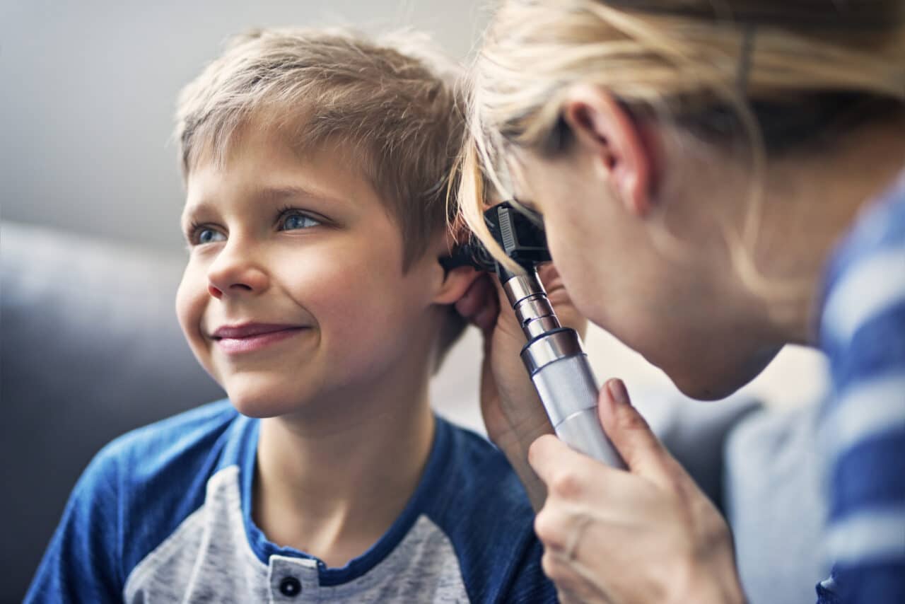 Little boy having an ear exam.