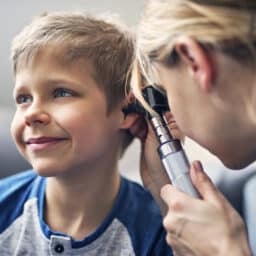 Little boy having an ear exam.