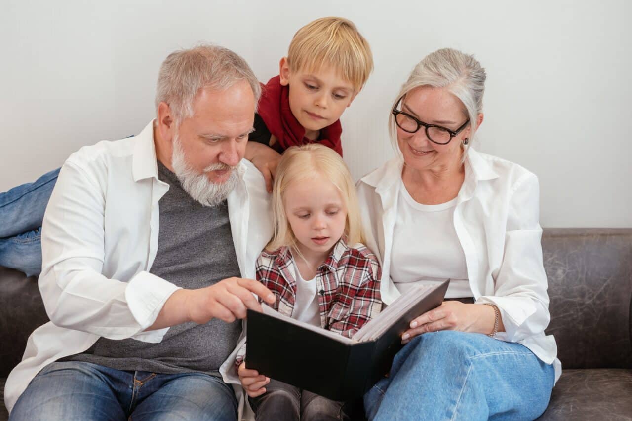 Happy older couple spending time with their grandchildren.