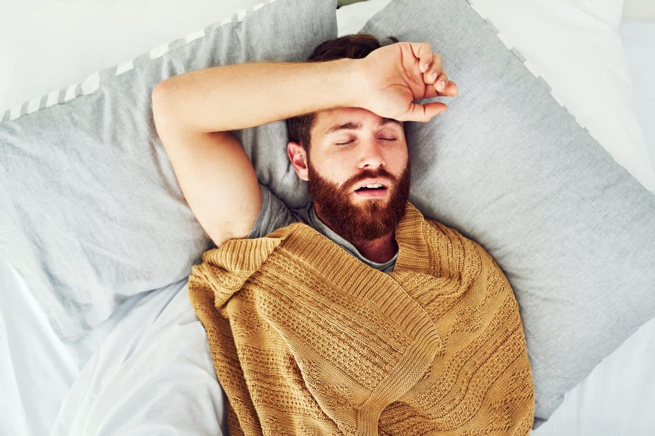 Young man snoring in his sleep.