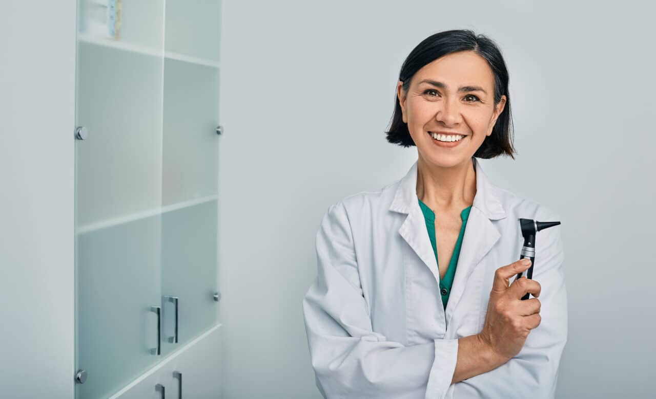 Photo of a smiling audiologist.