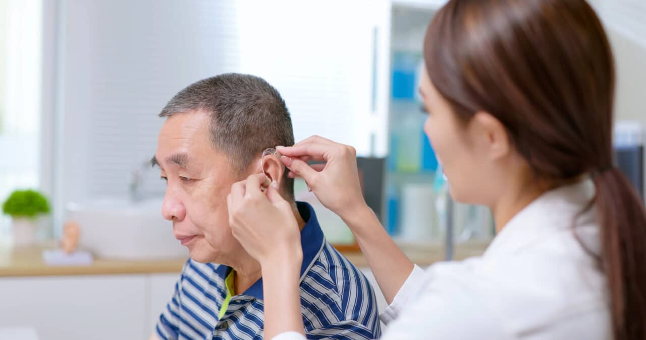 Man is fitted with hearing aids