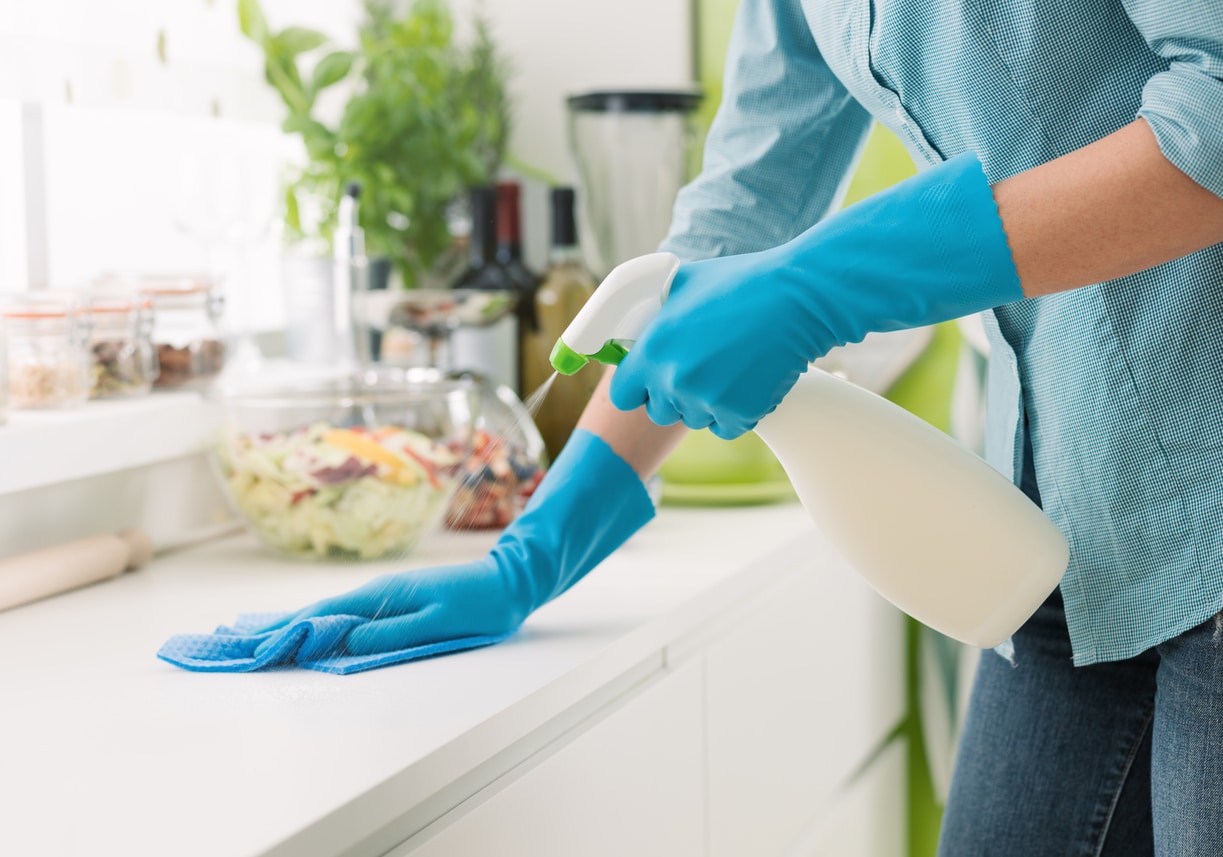 Cleaning the kitchen counter.