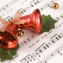 Jingle bells sitting on a music sheet