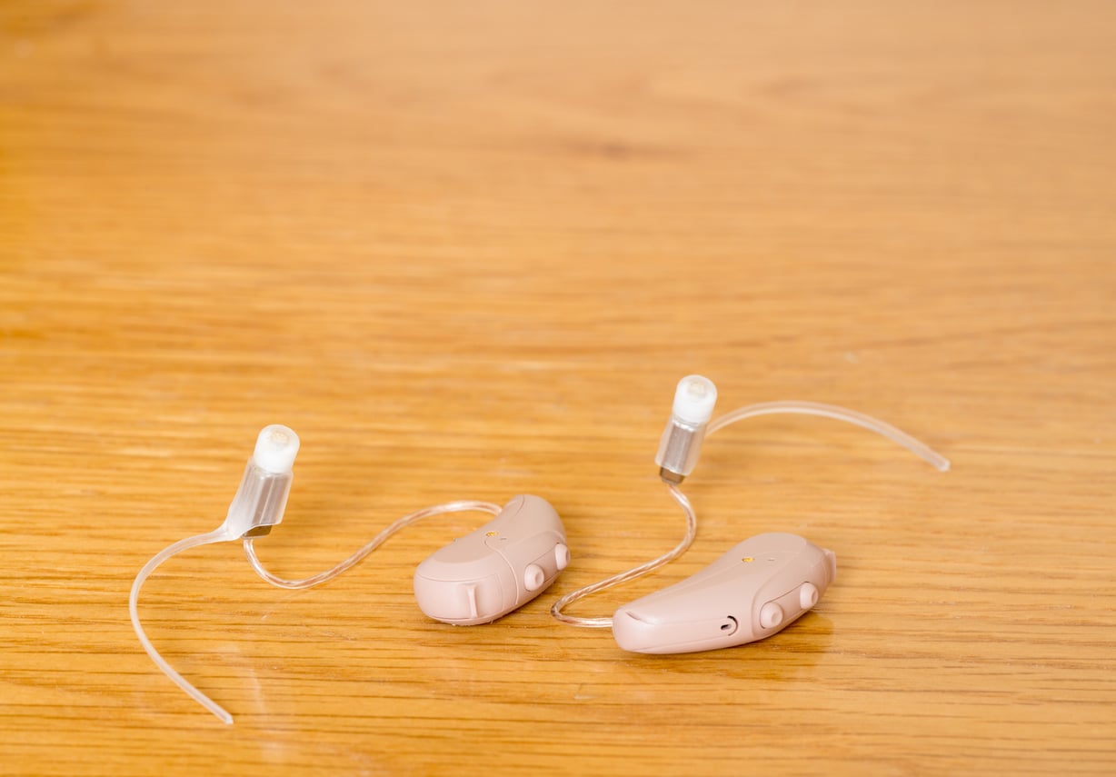 Close-Up Of Hearing Aid On Table.